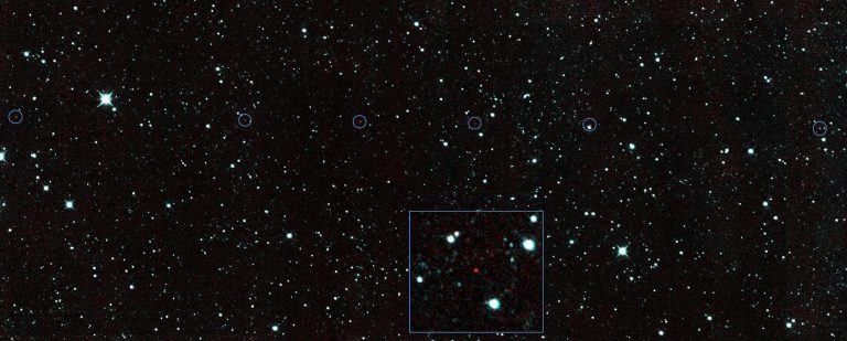 Telescopes Now Spot Smaller Asteroids Much Earlier A rugged asteroid drifts against a dense field of bright stars in deep space.