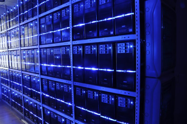 Open-Source AI Models Are Closing the Gap Rows of server cabinets inside a modern data centre